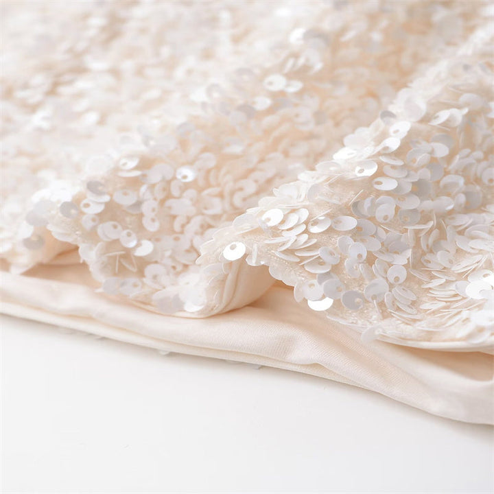 Amelia – Veste courte polyvalente ornée de nœuds et de paillettes